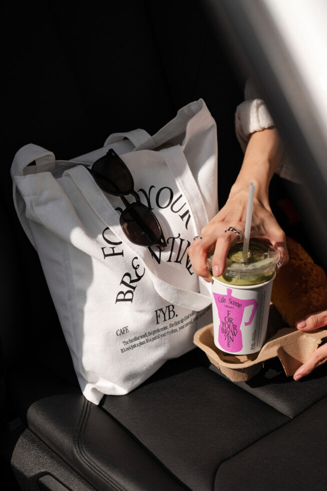 Tote bag mockup with coffee cup showing customizable branding placement