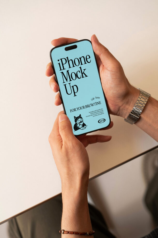 Hands holding iPhone with light blue screen cafe branding mockup
