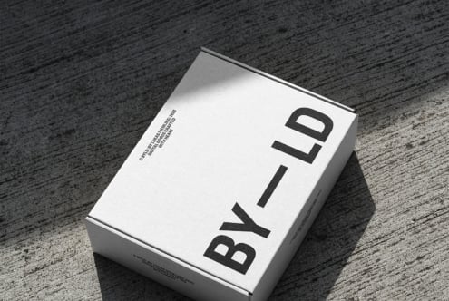 Minimalist white box with bold black BYILD lettering