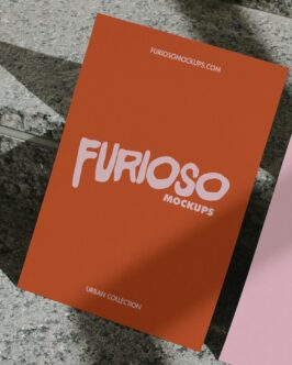 Bright orange card with pink FURIOSO lettering on concrete surface