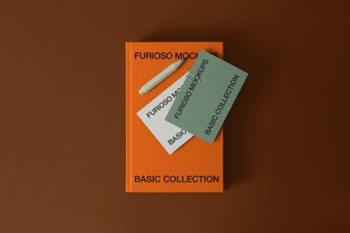 Orange book with layered cards showing Furioso Mockups branding with pen