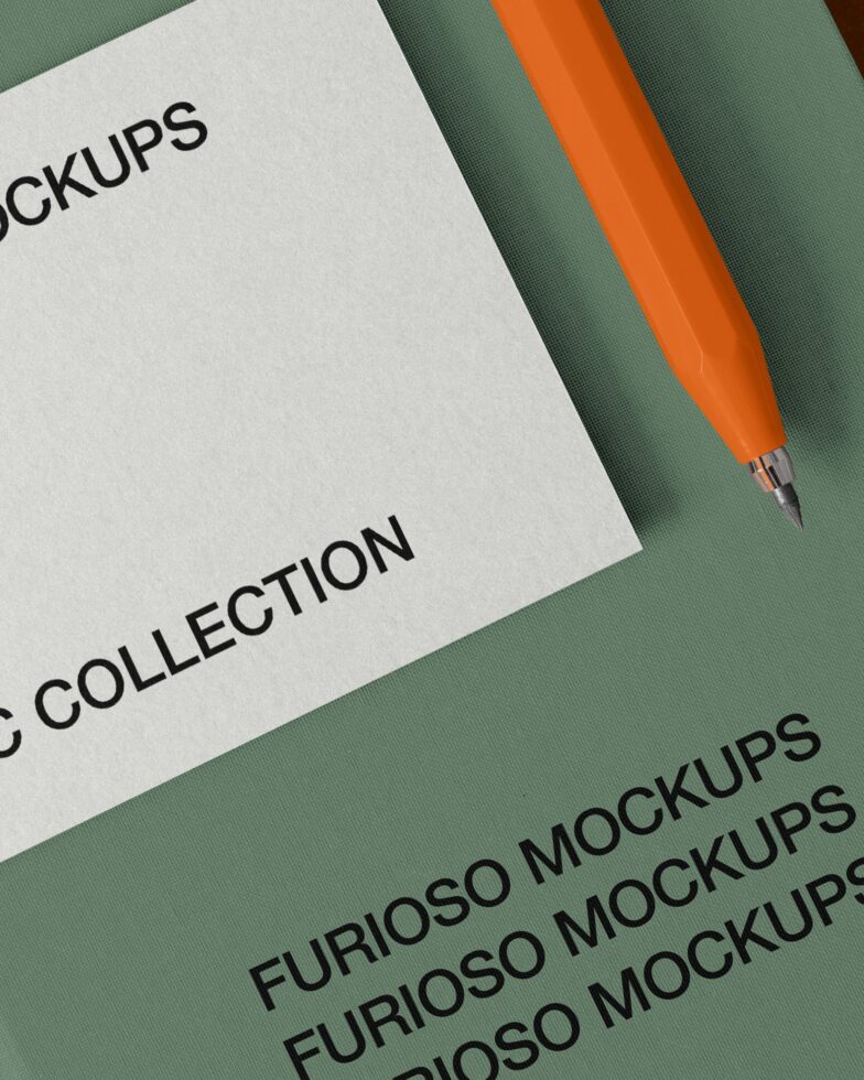 Flat lay of white paper, orange pen, green fabric with repeated Furioso Mockups text