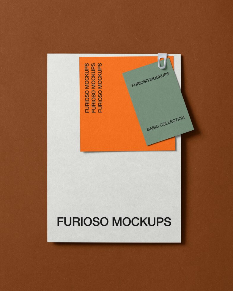 Flat lay of stationery mockup with orange folder, green notepad clipped to white envelope