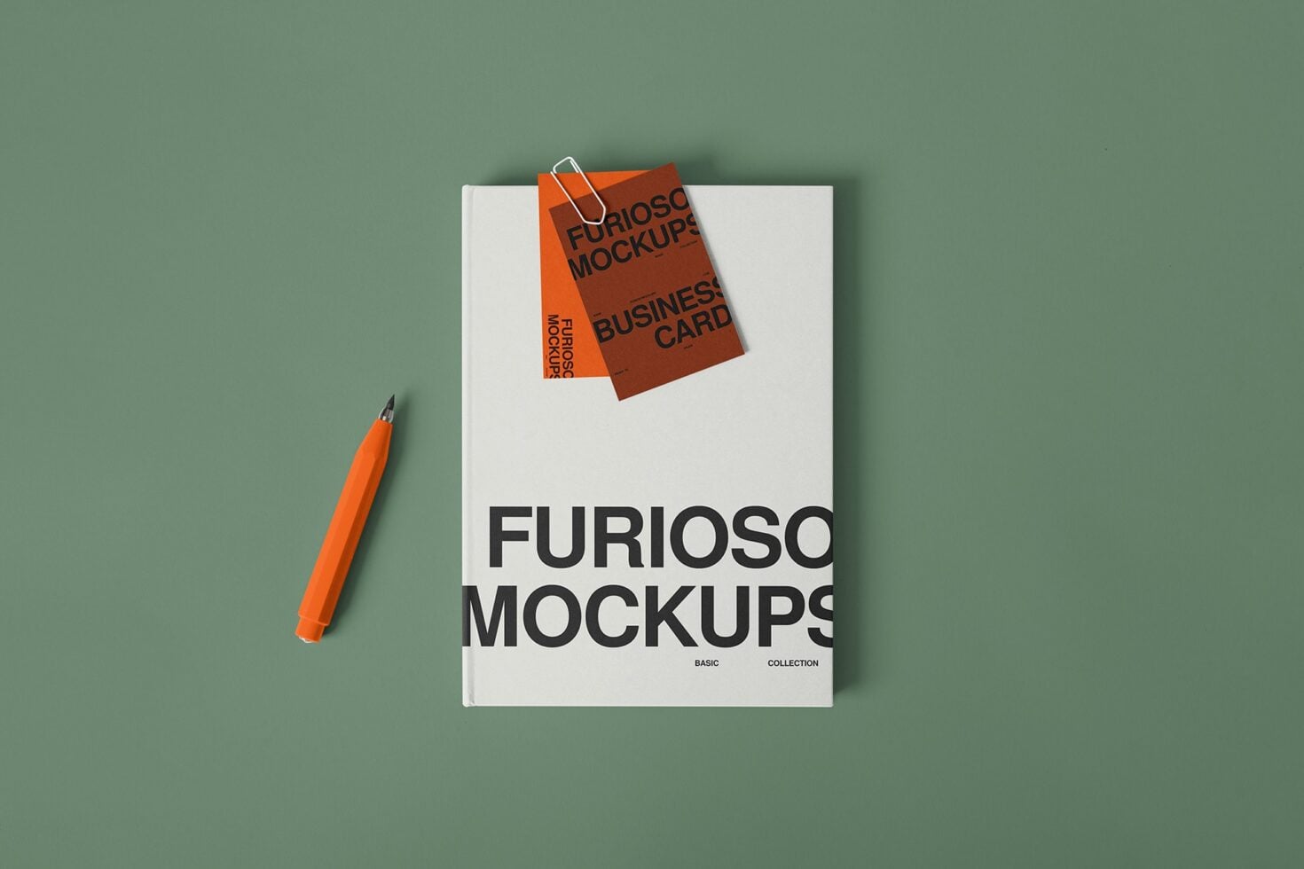 Open magazine mockup with business card floating above, orange pen nearby