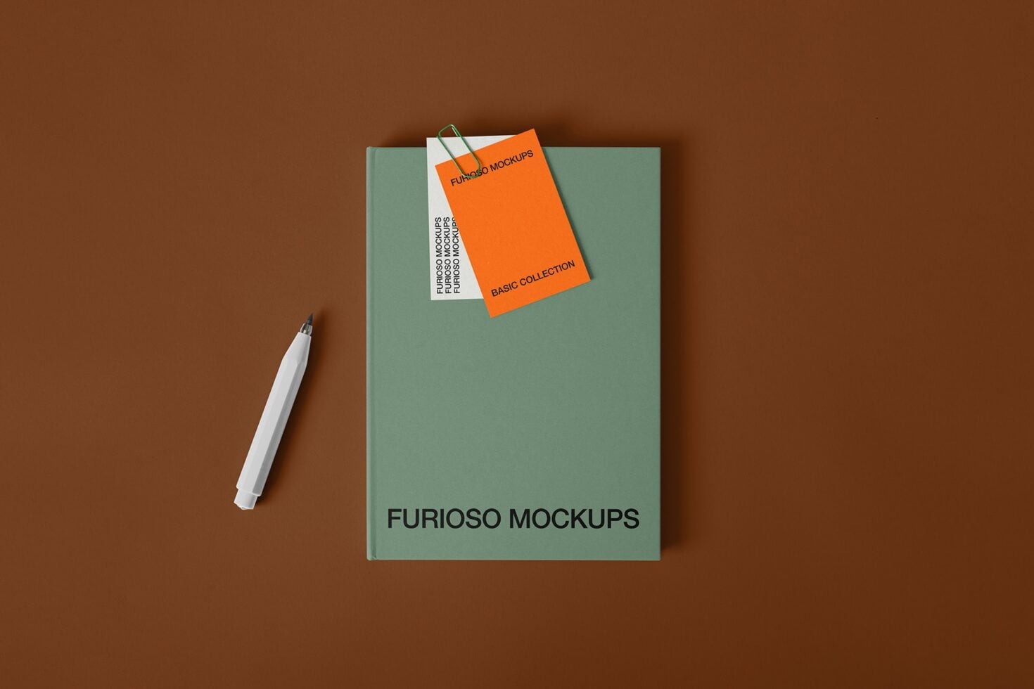 Sage notebook with orange business card mockup, pen on brown surface