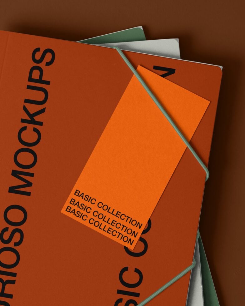 Stacked notebooks with orange cover showing Basic Collection text