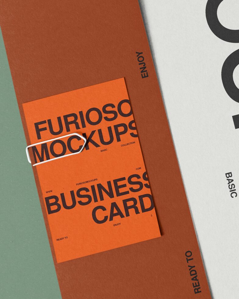 Orange business card mockup wrapped on rust folder with sage green border