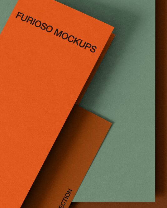 Orange folded card mockup with brown spine on split sage green background