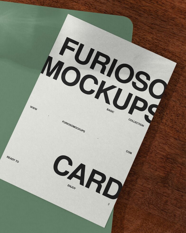 Business card mockup positioned on sage green surface with wood texture