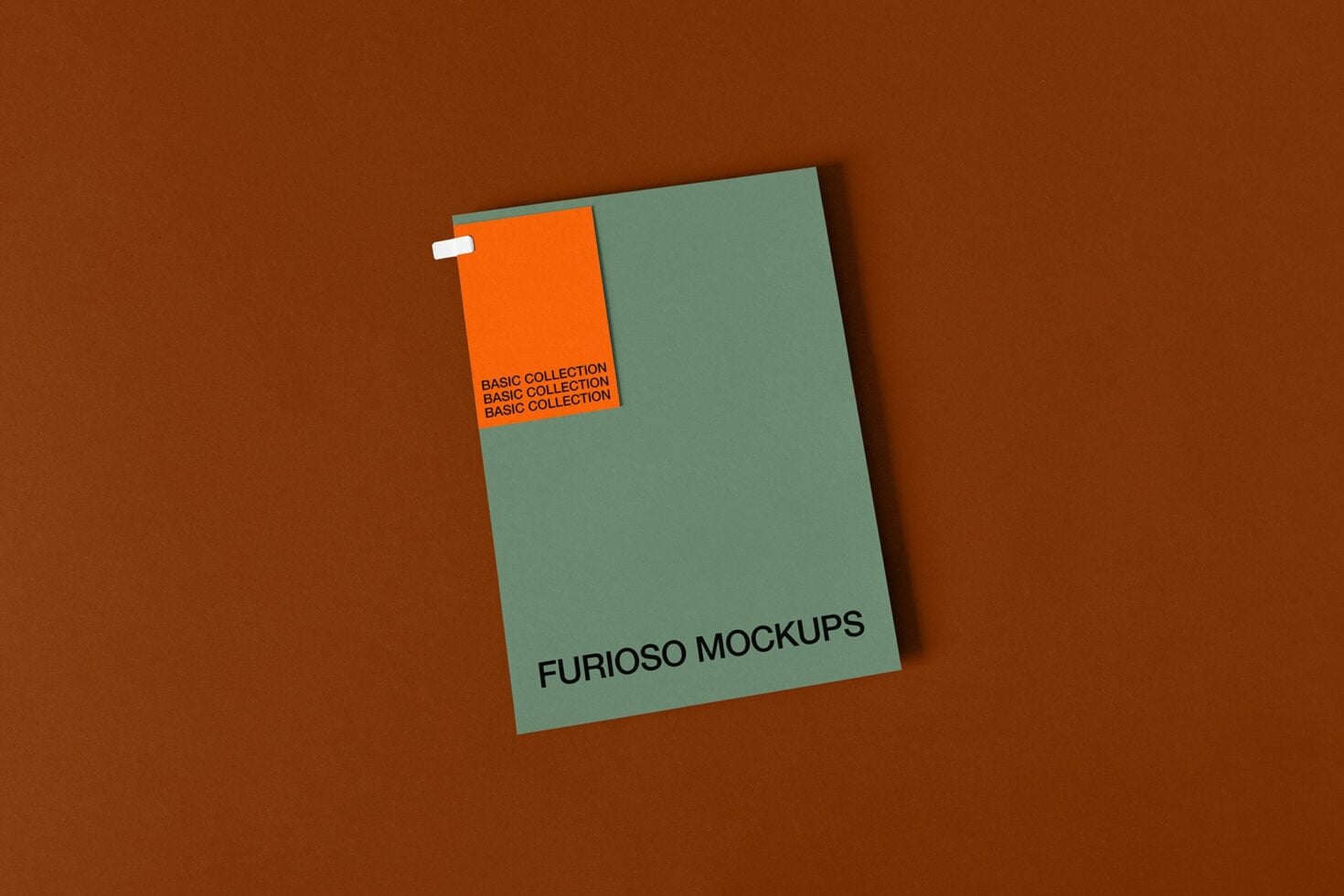 Sage green business card mockup with small orange tab on brown background