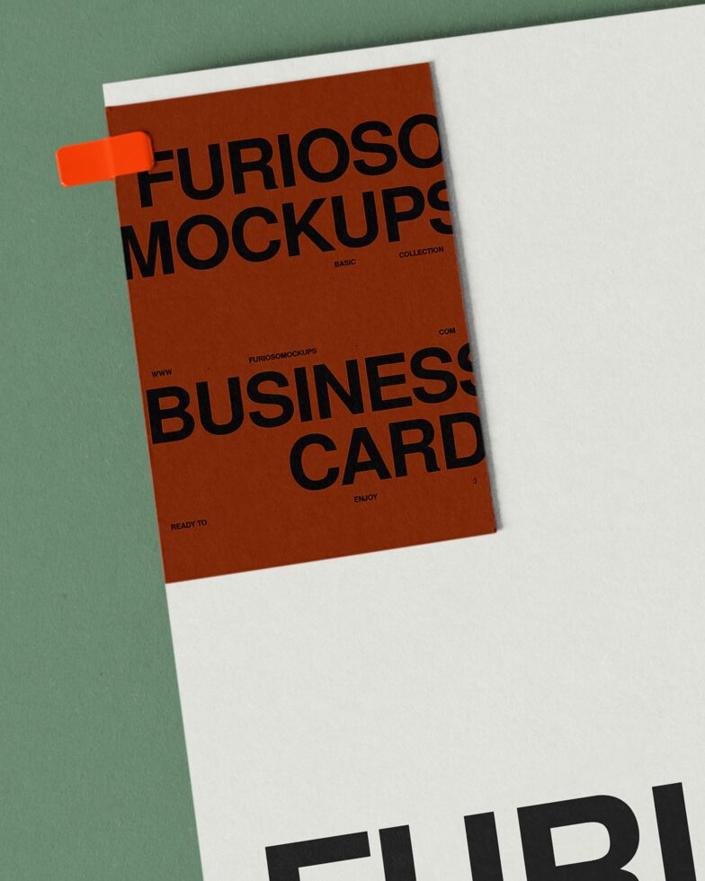 Business card mockup with orange tape accent on white cover sheet