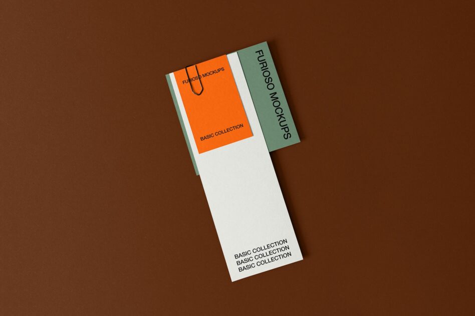 Two folded business card mockups stacked, orange with sage green accent