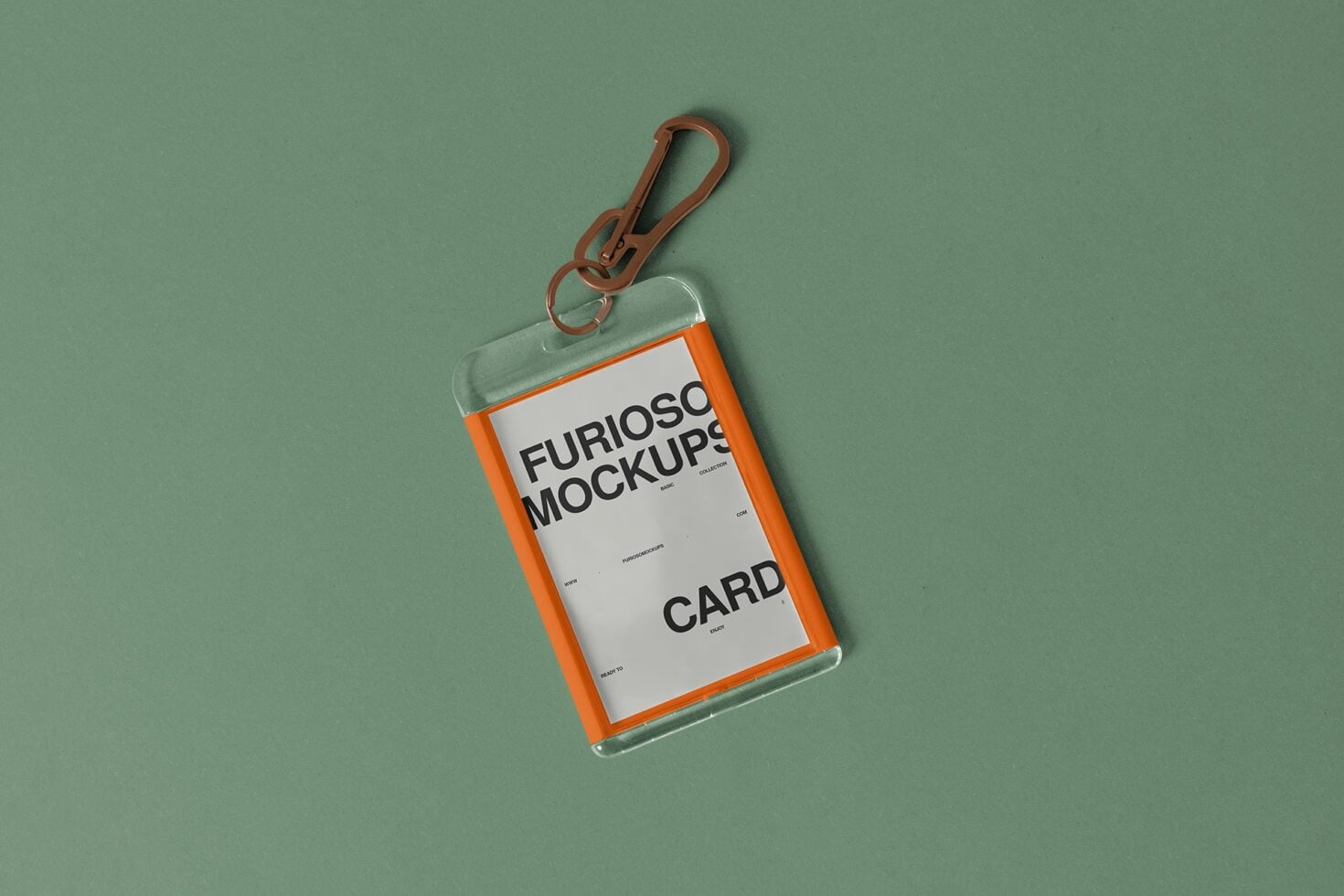 Orange ID card holder with brown carabiner clip on sage green background