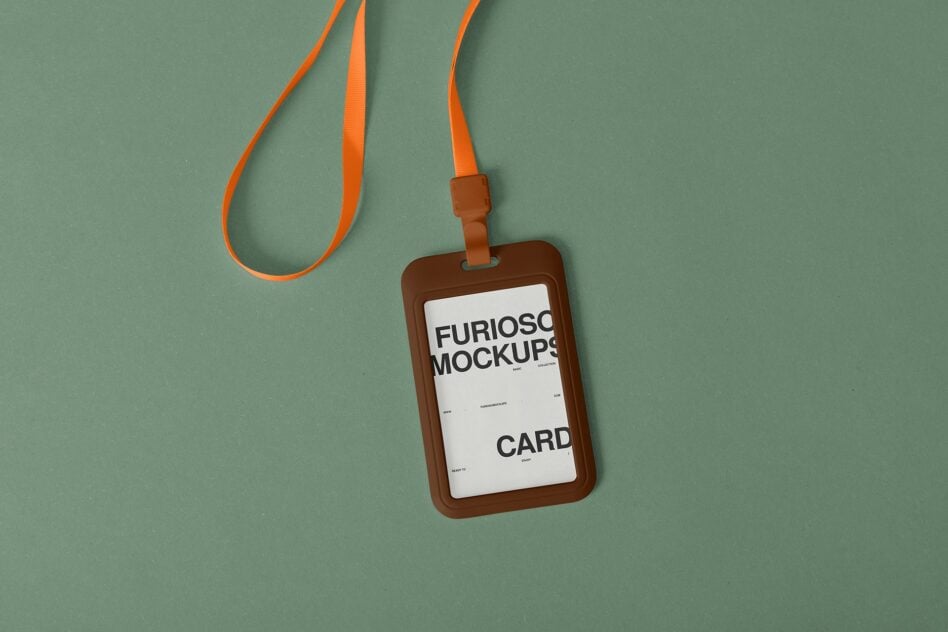 Brown leather ID badge holder with orange lanyard on sage green background