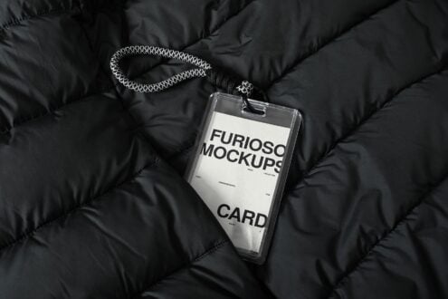 Clear lanyard card mockup with white insert on black puffer jacket detail