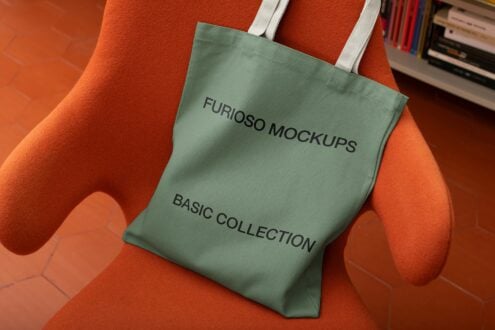 Sage green canvas tote hanging with Furioso Mockups text, orange background with books
