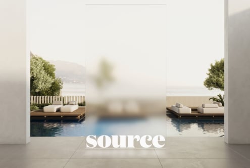 Luxury poolside mockup with white curved loungers, wooden deck, lush greenery, lake view in background