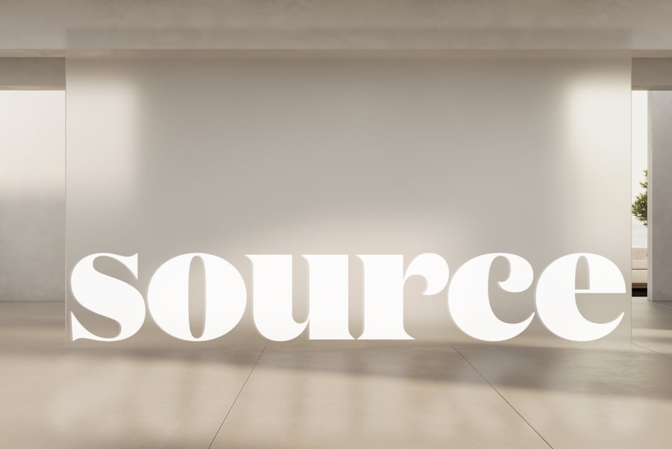 Sculptural white text displayed in clean minimal hallway with side lighting