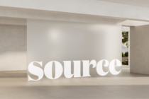 Bold white typography installation in modern interior with soft ambient lighting
