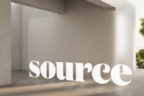 White dimensional lettering installed in minimalist interior space with natural light