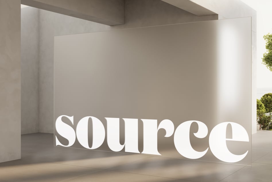 White dimensional lettering installed in minimalist interior space with natural light