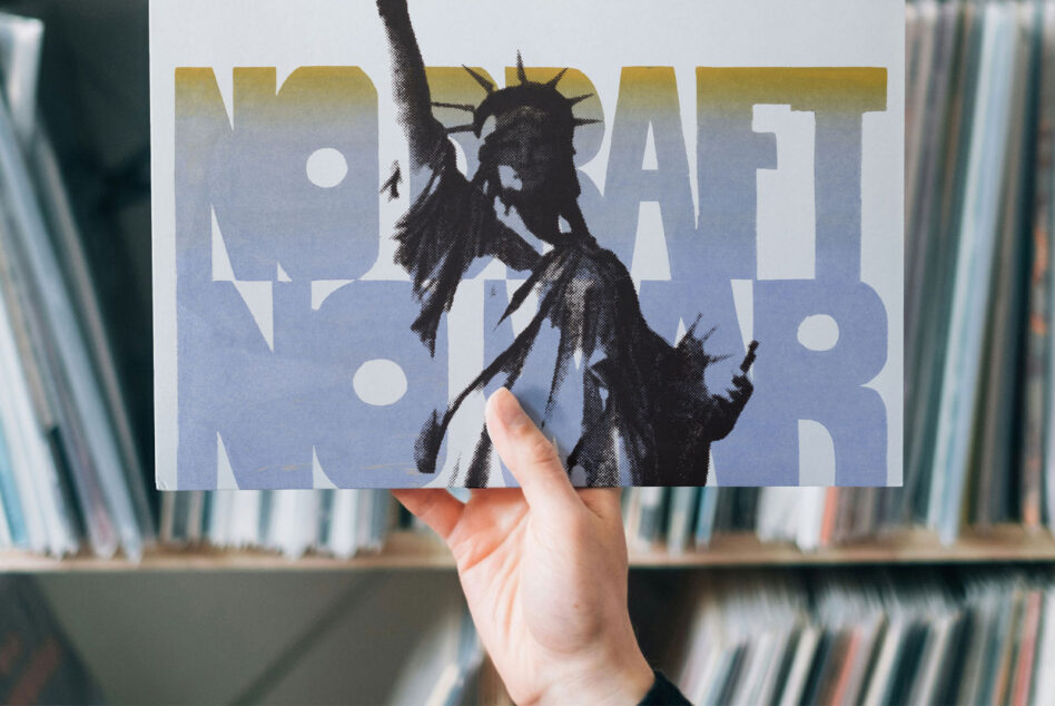 Liberty statue silhouette layered over large blue gradient text poster held in hand