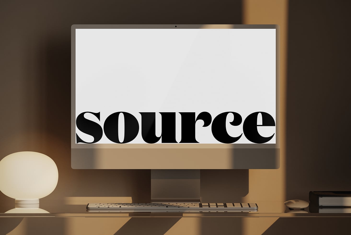 Monitor screen displaying bold serif text centered on white with minimalist desk setup below