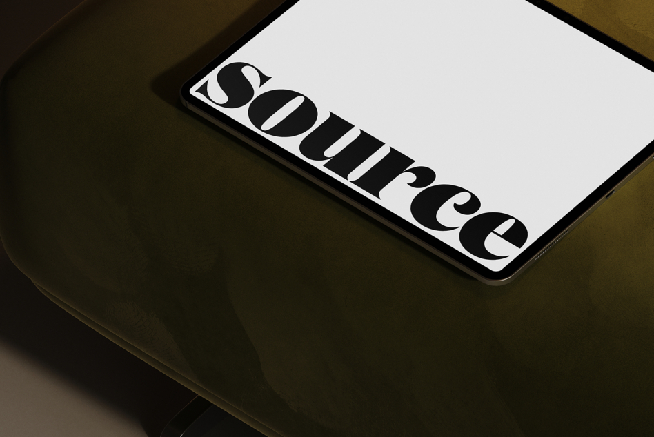 Smartphone screen showing geometric logo design on white surface tilted view
