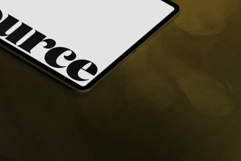 Mobile device corner showing partial serif typography in close-up