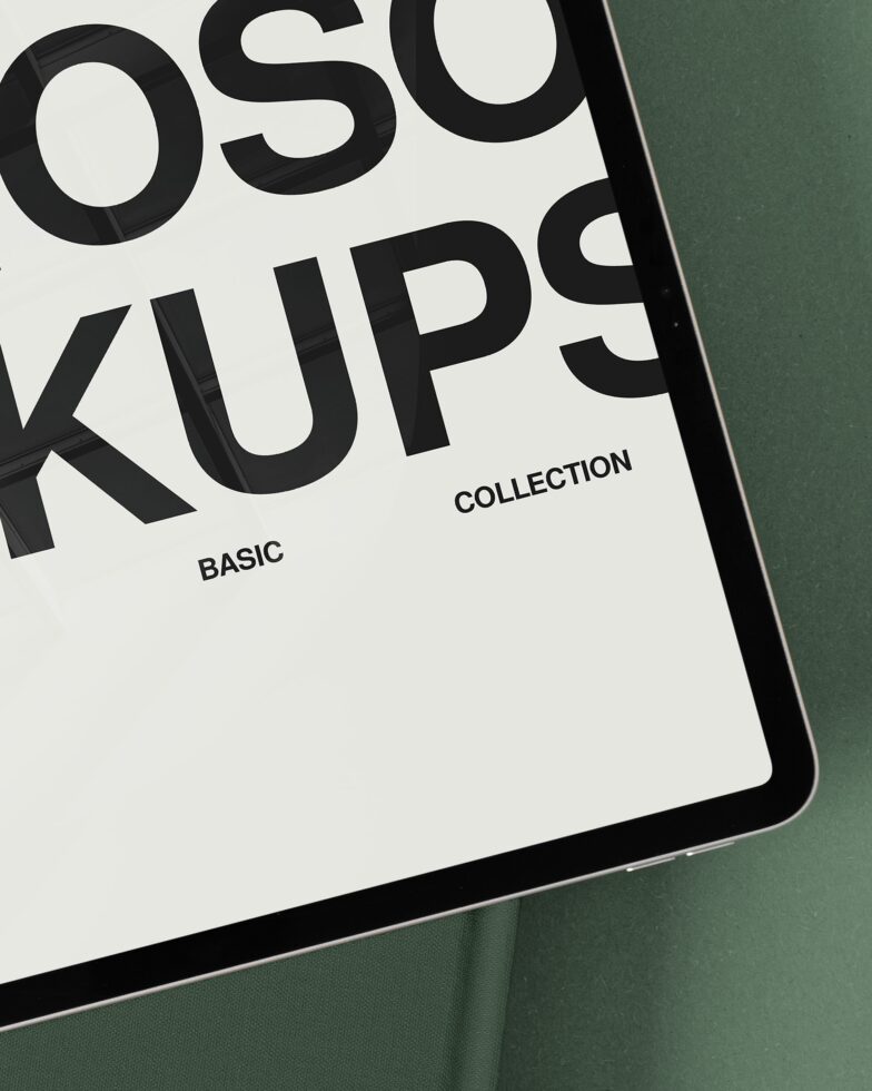iPad close-up showing bold black typography on white screen