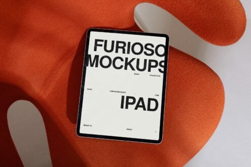 iPad mockup on rust fabric displaying white screen with black text layout