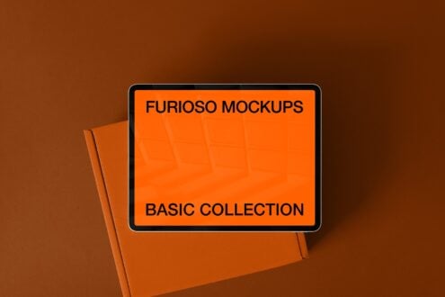 Tablet mockup on brown background with orange paper folder leaning against it