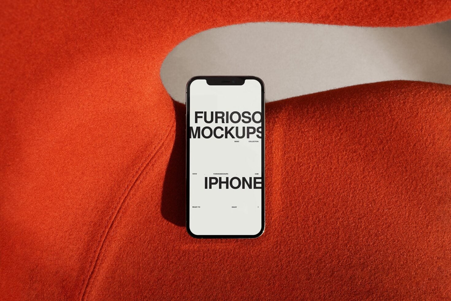iPhone mockup displaying white screen layout on red textile