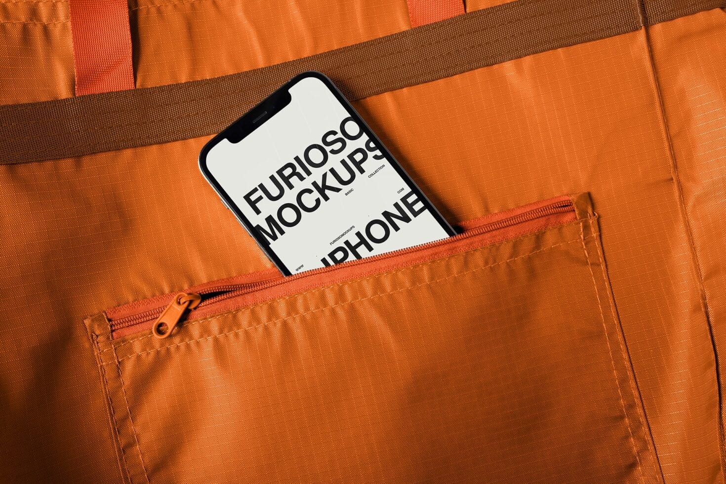 White iPhone mockup tucked inside bright orange backpack front pocket