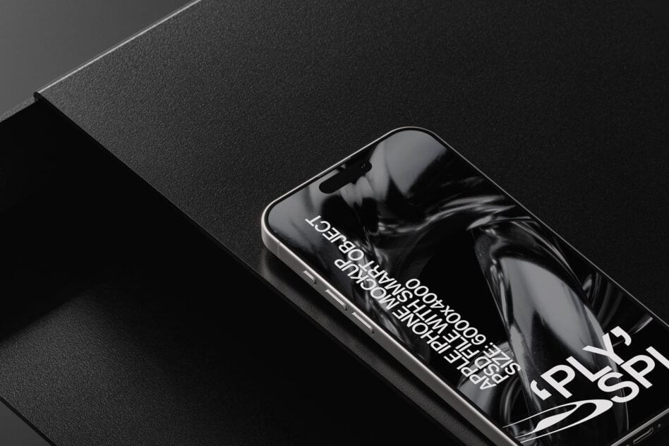 Smartphone on textured black paper with overlaid type specimen