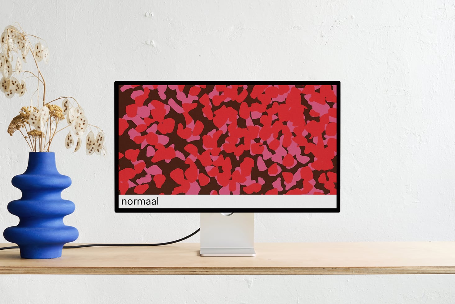 Monitor display mockup showing red abstract pattern, desktop styling scene