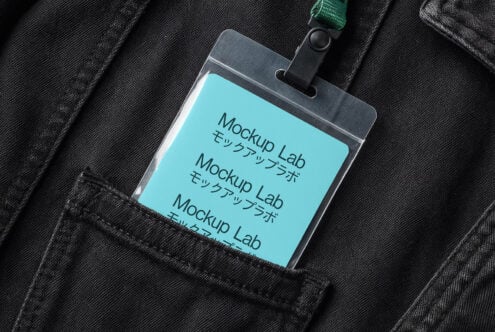 ID badge mockup with turquoise display on black jacket pocket with green strap