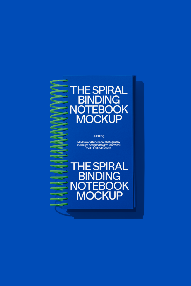 Spiral notebook with bright lime green coil binding on vibrant blue backdrop