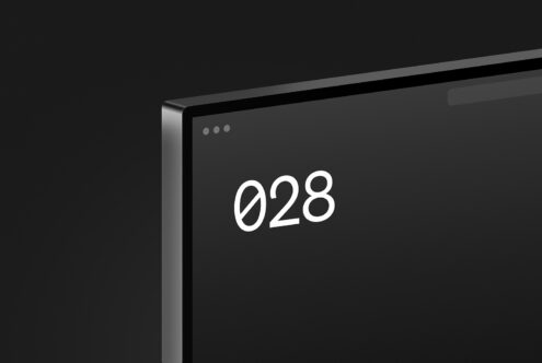 Laptop screen mockup displaying large white number 028 on dark background