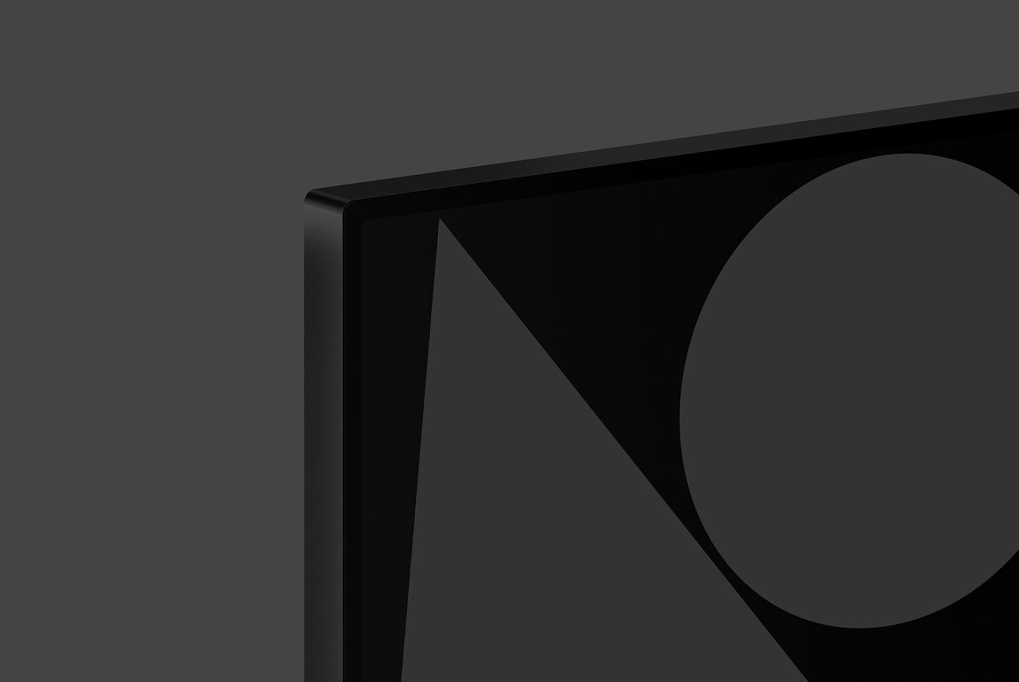 Laptop screen mockup angled view with geometric triangle shape on display