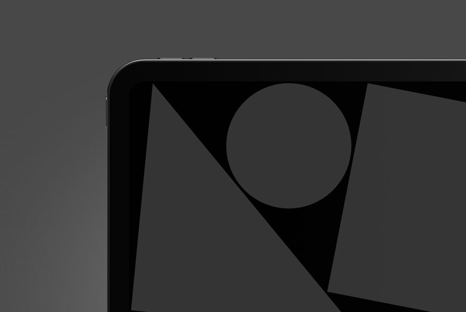 Dark tablet screen with geometric shapes circle triangle on black surface