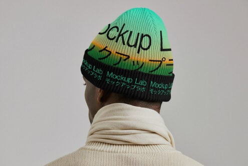 Back view of person wearing mint green, yellow striped knit beanie