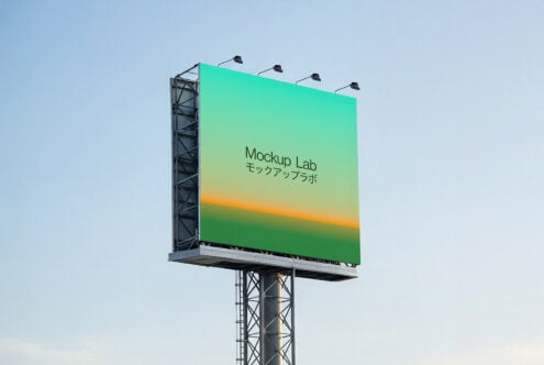 Tall billboard with gradient from turquoise to orange with four mounted lights