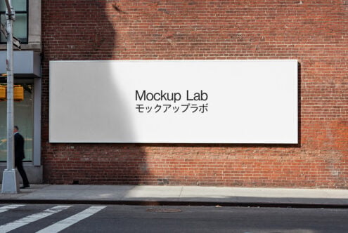 Horizontal sign on brick wall with Mockup Lab text in English plus Japanese