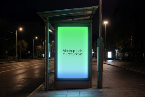 Bus shelter at night with gradient screen transitioning from green to cyan on dark street