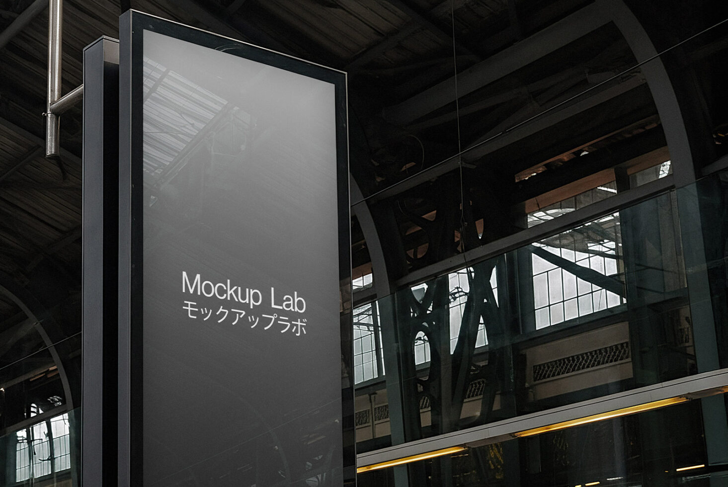 Blank metal signage hanging from industrial ceiling with dark background