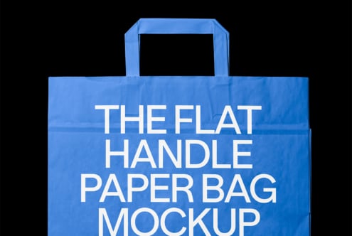 Bright blue paper bag with flat handles showing white text on black background