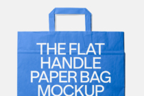 Blue paper shopping bag with flat handles on light gray background mockup