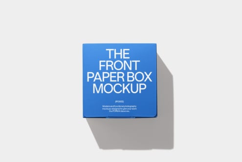 Blue paper box mockup on neutral background casting subtle gray shadow