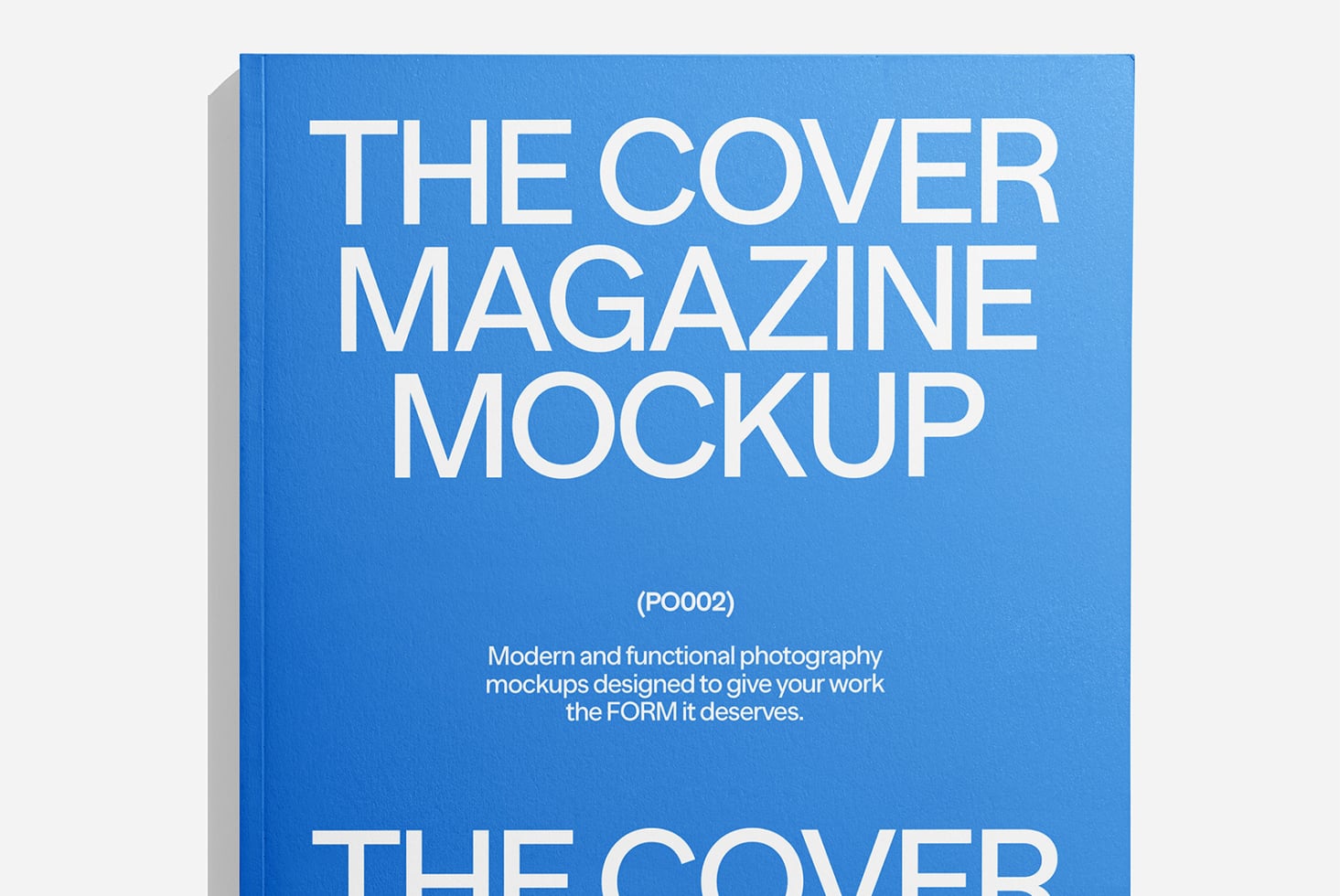 Blue magazine cover mockup angled to show depth with shadow detail